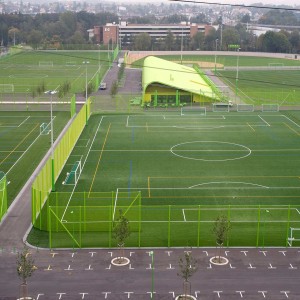 Heerenschürli serves as a hybrid sports complex and public park, giving the neighborhood facilities for organized sports as well as general leisure activities. A public square with seating and a restaurant are integrated into the complex; the lawns themselves are also public - openly accessible during the off-hours of the local athletic clubs.